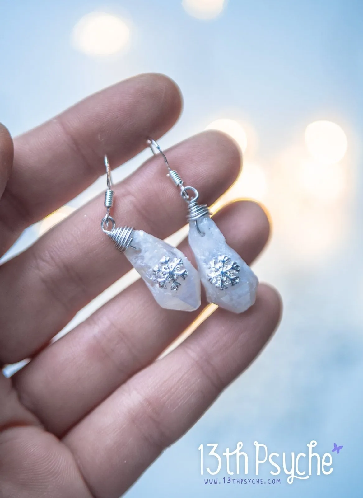 White raw stone earrings with silver snowflake